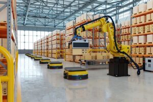 Autonomous mobile robots and a robotic arm handling boxes in a warehouse